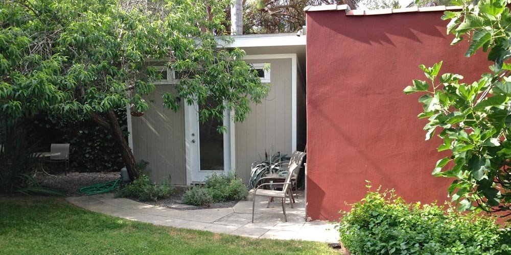 Original Brookside guesthouse exterior before renovation