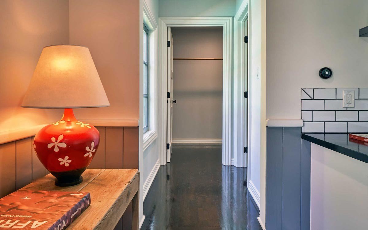 Finished guesthouse hallway and millwork detail near the kitchen