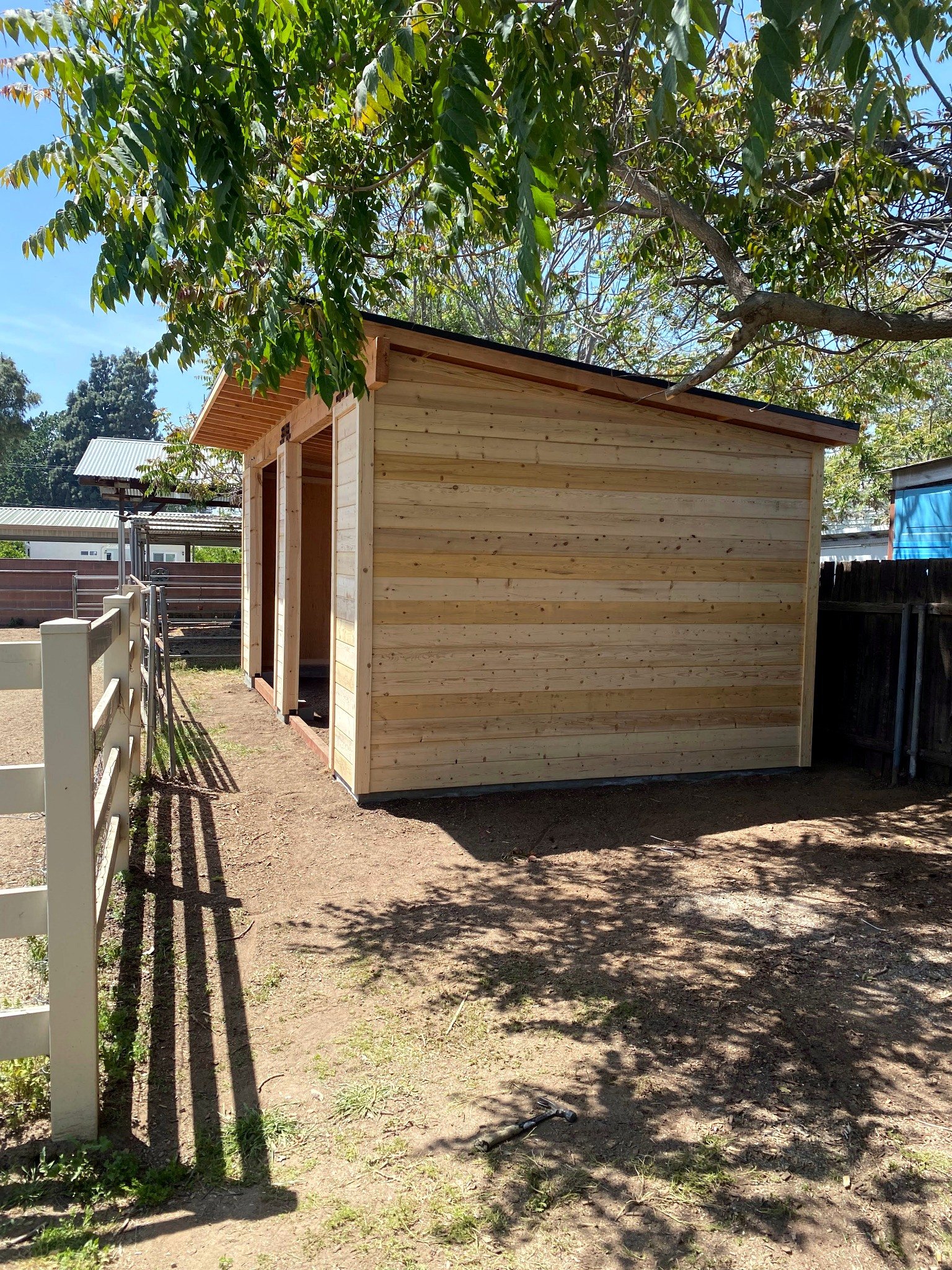 Wood-sided barn exterior nearing completion