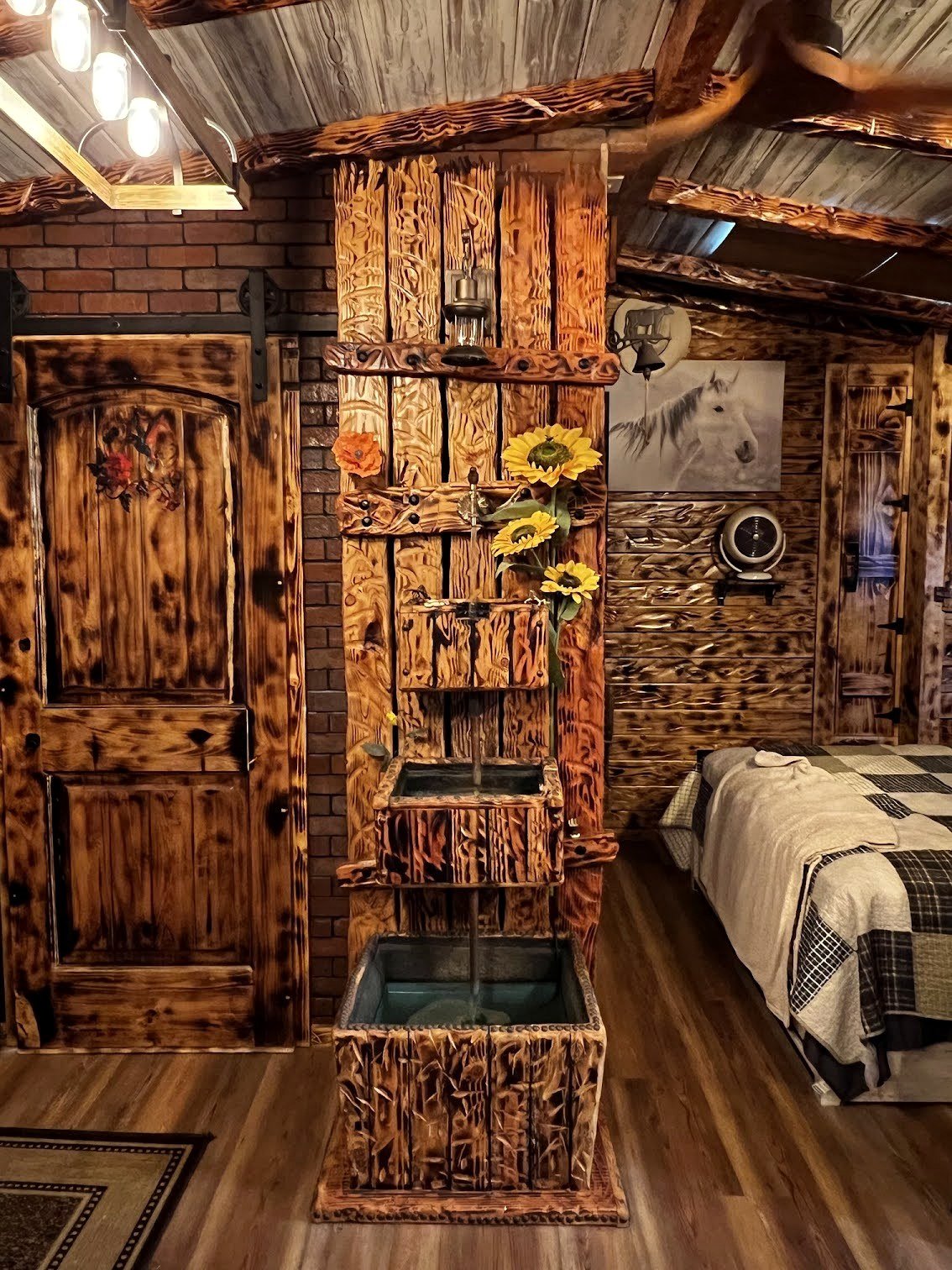 Tiered rustic wood water feature inside the ADU