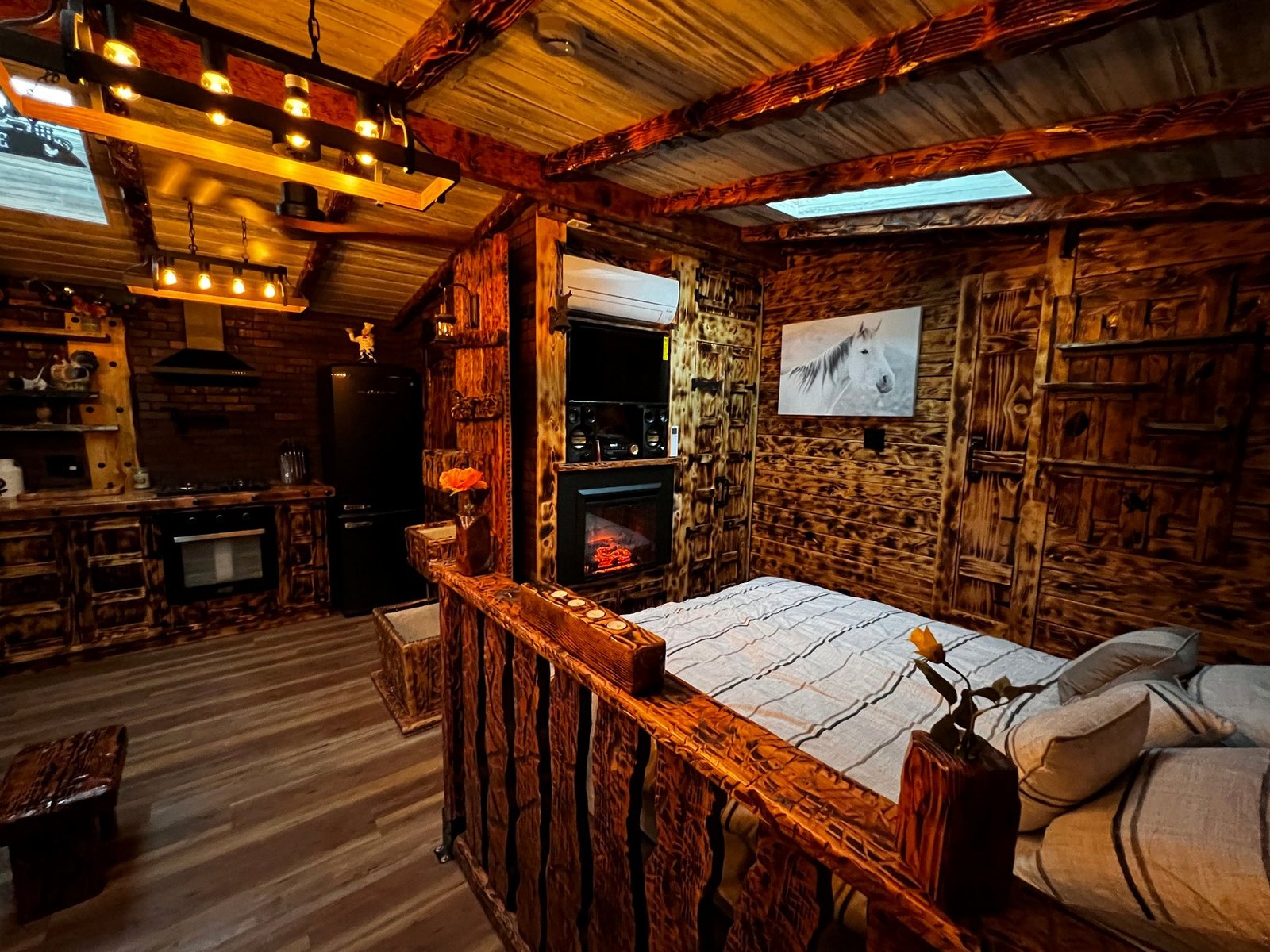 Finished sleeping area with exposed beams and rustic woodwork